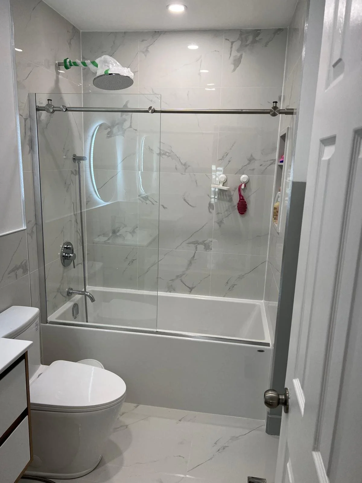 Renovated bathroom vanity with vessel sink and mirror lighting
