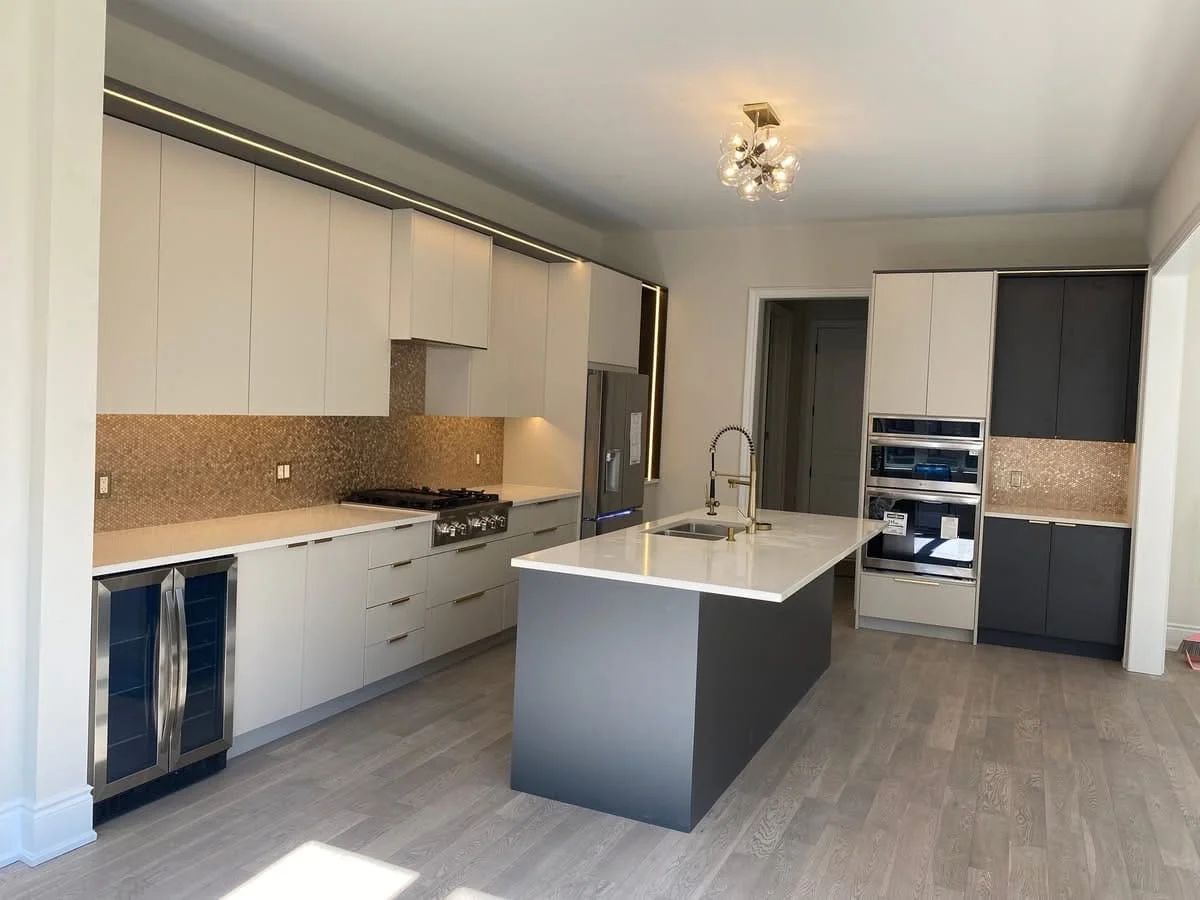 Open-concept kitchen remodel with center island and pendant lights